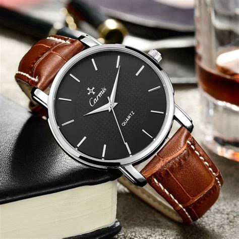 black dial watch with brown band